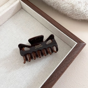 Pince à cheveux vintage en écaille foncée avec lettrage doré Barrette La France élégant