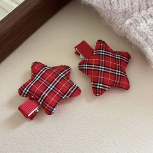 Pair of red tartan star hair clips with festive plaid pattern for girls' hair styling