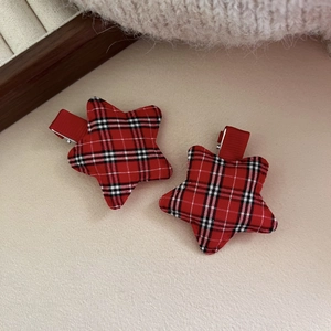 Red star hair clips with festive tartan pattern for New Year and Christmas styling