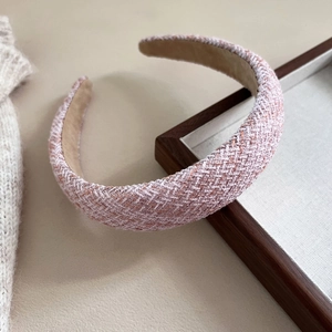 Detailed view of pink tweed headband texture with soft anti-slip inner velvet lining