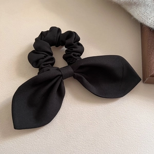 Elegant large black rabbit ear bow scrunchie with soft pleated fabric for women