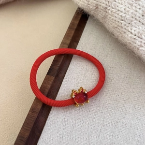 Red high elasticity hair tie with golden crab ornament and red gemstone inlay