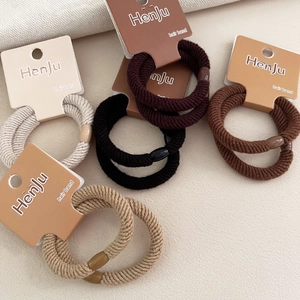 Detail of two-piece thick twill elastic hair bands set in assorted coffee and black colors