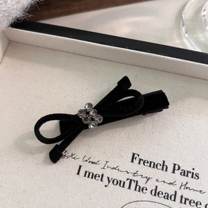 Vintage black velvet bow hair clip with sparkling rhinestone flower and metal duckbill clip