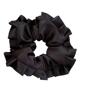 Elegant large black satin scrunchie with soft ruffled texture and premium glossy finish