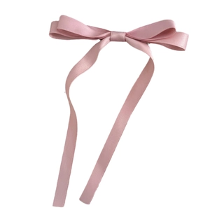 Elegant pink satin bow hair clip with long ribbon streamers for princess hairstyle