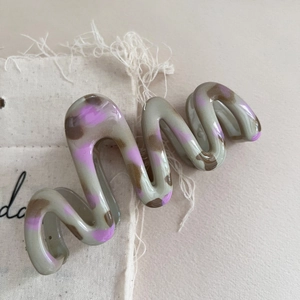 Elegant wavy leopard print hair claw clip in grey and purple tones for spring hair styles
