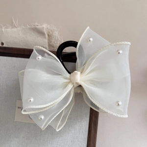 Elegant beige organza oversized bow hair claw clip with delicate pearl accents for women