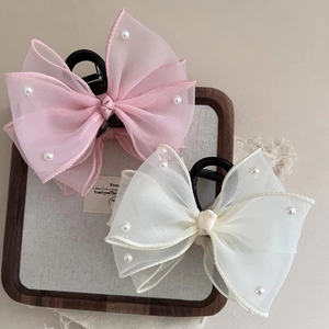 Elegant pearl gauze bow hair claw clips for women in soft pink and cream colors