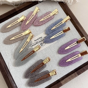 Elegant acetate hair clip set with glitter finish in a wooden display box