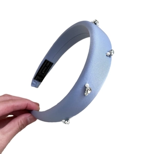 Light blue padded satin headband with elegant pearl and crystal bead embellishments