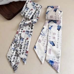 Detailed view of silk ribbons with Chinese calligraphy and blue butterfly patterns