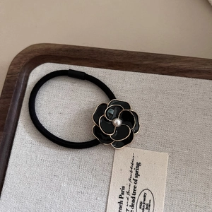 Elegant black camellia hair tie with golden edges and pearl on high-elasticity rope