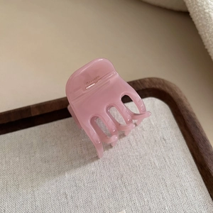 Pink acetate hair claw clip with French design for ponytail hairstyle in high-gloss finish