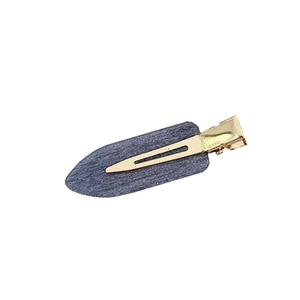 Elegant dark grey acetate seamless hair clip with golden metal clip on white background
