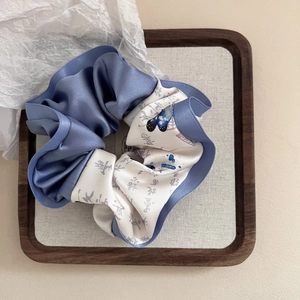Detail of vintage Chinese style scrunchie with lavender satin and butterfly calligraphy print