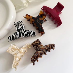 Set of five retro acetate hair claws in tortoise shell and marble patterns for women
