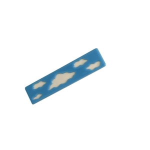 Minimalist blue acetate hair clip with white cloud pattern and sleek rectangular design