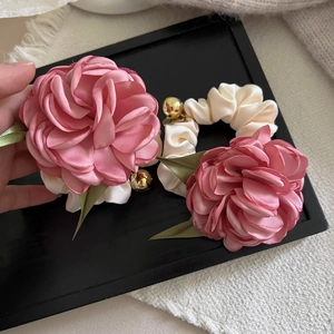 Romantic pink satin camellia flower scrunchie set with elegant gold bead details