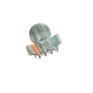 Elegant green and orange marble pattern acetate hair claw clip with Barrette La France text