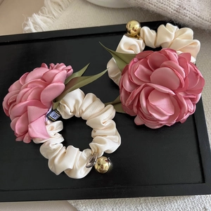 Romantic camellia hair scrunchies set in cream and pink satin with elegant gold charms