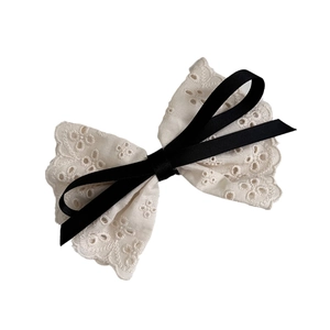 Elegant French style white lace bow hair clip with black ribbon accent for women