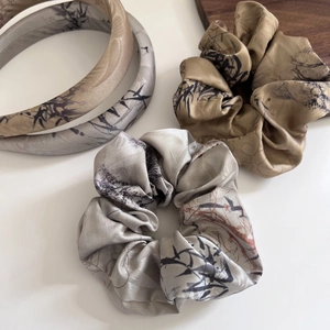 Detail of silk satin headbands and scrunchies with ink wash bamboo leaf pattern