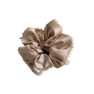 Elegant champagne satin scrunchie with pearl beads for sophisticated ponytails