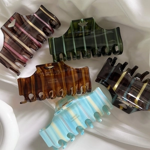 Premium handmade acetate hair claw clips with elegant heart stripes and color-block patterns