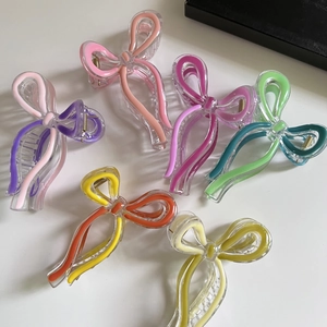 Colorful acrylic bow hair claws in six vibrant shades for women elegant hair styling