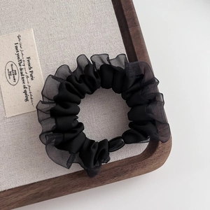 Elegant black mesh hair tie with satin center and organza ruffle for women's hairstyle