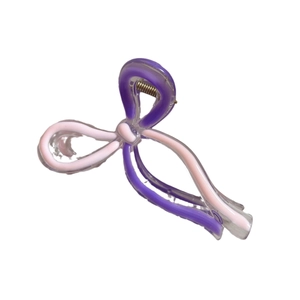 Colorful acrylic bow hair claw clip in purple and pink tones with a secure metal spring