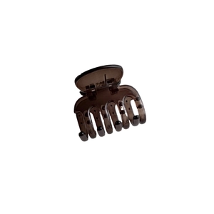 Brown translucent shark hair claw clip for elegant buns and minimalist hairstyles