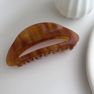 Classic brown tortoiseshell acetate hair claw clip with cutout design for women