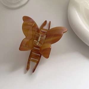 Elegante molletta per capelli a farfalla in acetato ambra con scritta Barrette La France