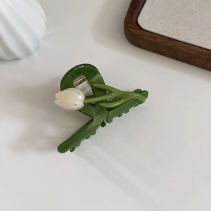 Elegant green tulip hair claw clip with 3D floral design for French style hair styling