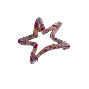 Star-shaped acetate claw clip with pink marble texture and gold metal spring closure