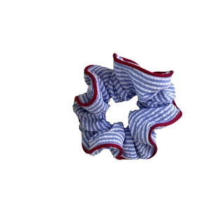 Elegant blue striped hair scrunchie with red piping edges for versatile hair styling