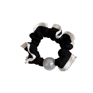 Elastic hair scrunchie with white lace edges and a decorative iridescent bead