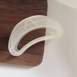 Large translucent cream white jelly hair claw clip with modern hollow arc design