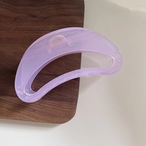 Detailed view of lavender translucent acrylic hair claw clip with strong metal spring