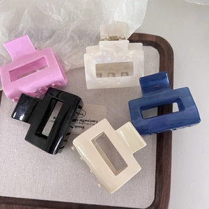 Detailed set of five colorful rectangular acetate hair claws with premium glossy finish