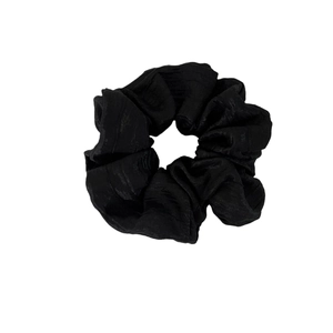Elegant black pleated satin scrunchie with subtle shimmer for French style hairstyles