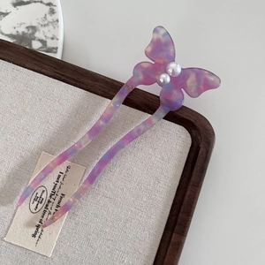 Elegant acetate butterfly hair pin in pink purple marble finish with pearl accents