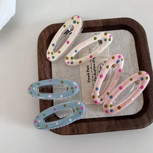 Oval hollow hair clips set with colorful rainbow polka dots in cream pink and blue