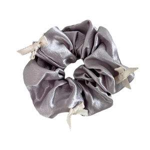 Elegant grey satin scrunchie featuring multiple cream-white ribbon bows for women
