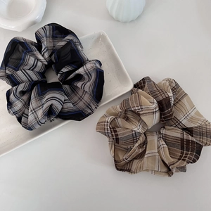 Vintage plaid scrunchie set in blue-black and beige chiffon fabric on white tray