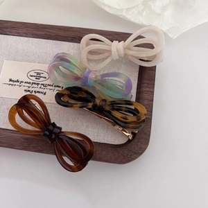 Elegant 4-piece acetate bow hair clip set in cream, tortoiseshell and gradient colors