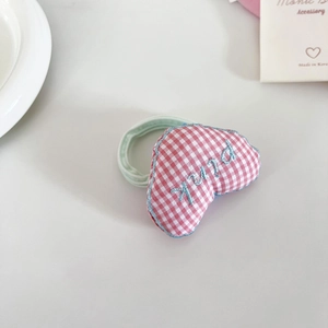 Cute red plaid heart-shaped scrunchie with blue embroidery and mint green elastic band