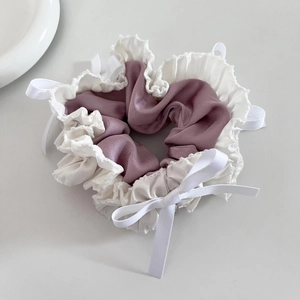 Purple satin scrunchie with white lace trim and bow for sweet ballet style hairstyles